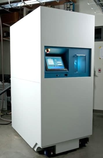 A white equipment cabinet about as tall as a person, on casters. A touch-screen panel is set into a blue recess in its front.